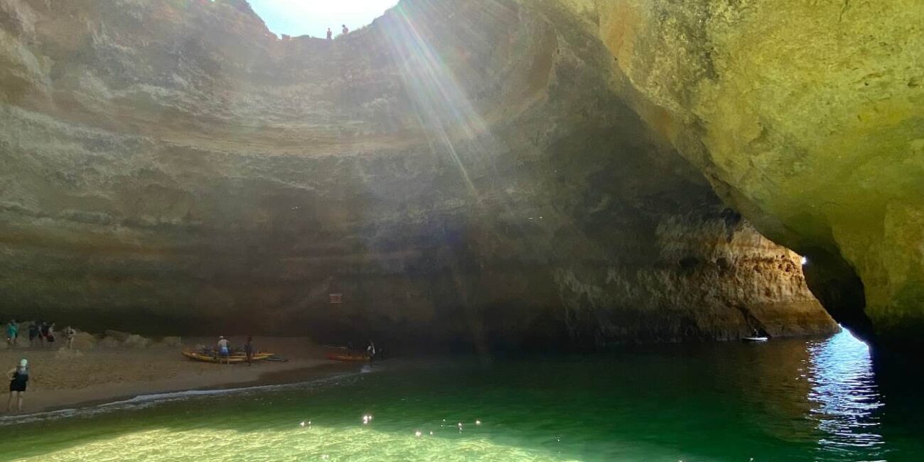 Golden beach and skylight inside Benagil cave