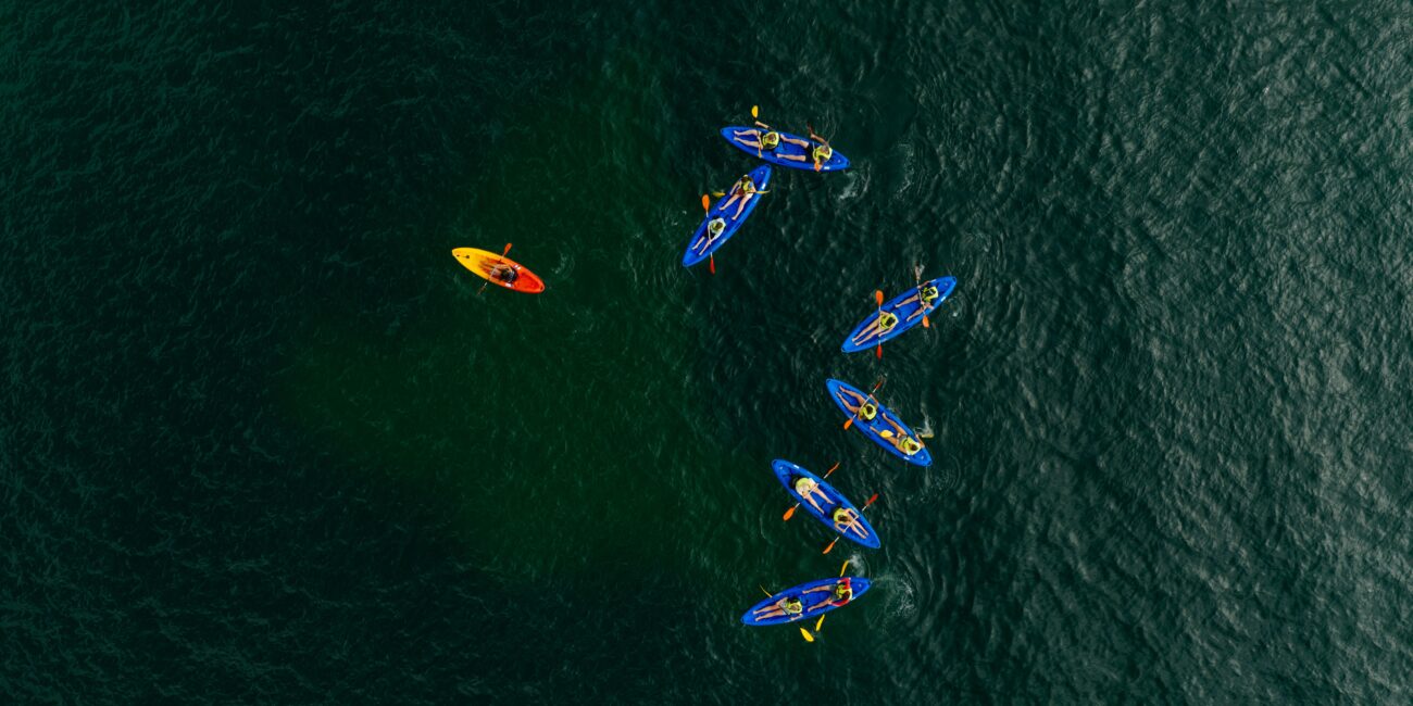 Kayaker in turquoise water at Ponta da Piedade