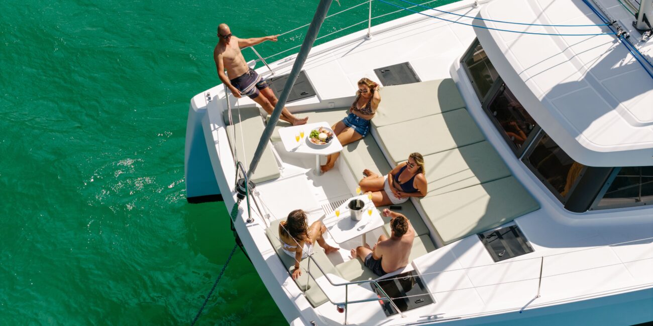 Paddle boarding from a private catamaran