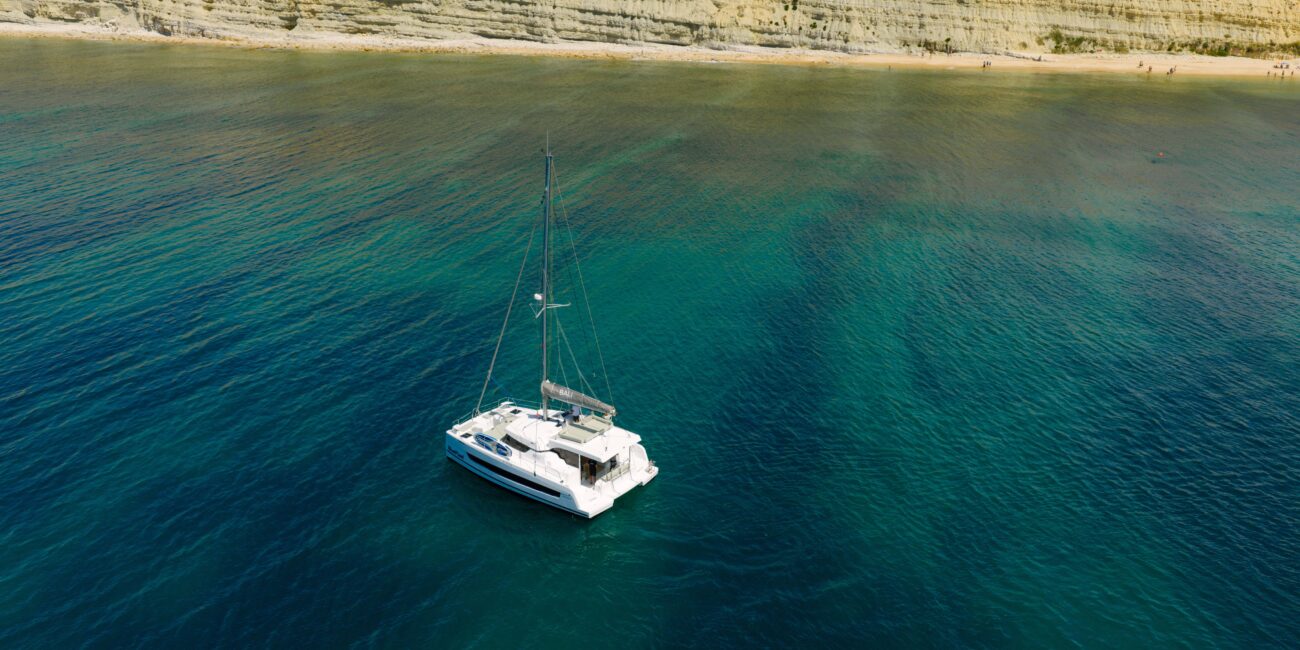 Catamaran trampoline with views of the Lagos coast