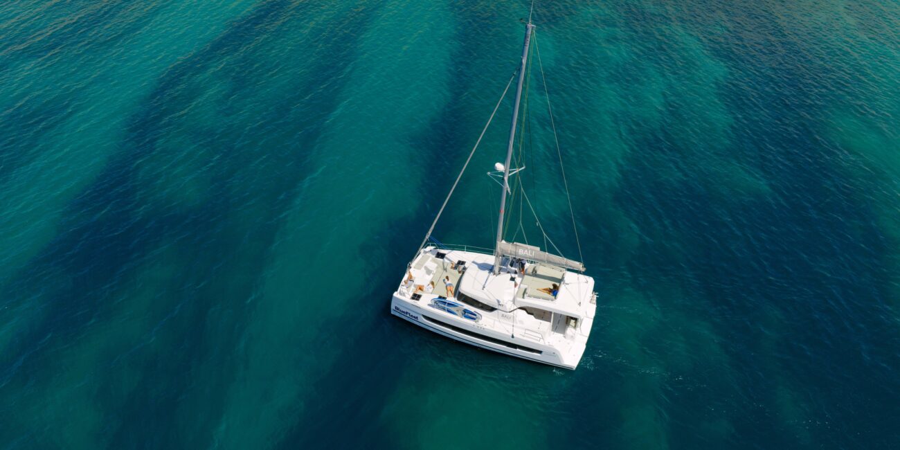 Guests on the deck of a private catamaran in Lagos