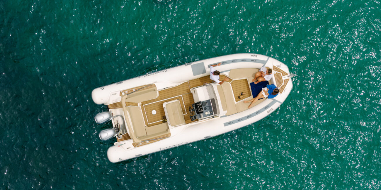Guests on a private boat tour along the Lagos cliffs
